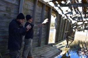 Students document deterioration of boat house on Bald Head Island, NC.