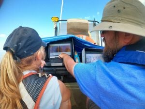 ECU professor and grad student view sonar waterfall.